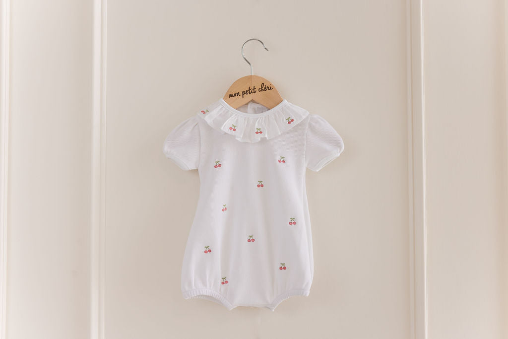CERISE EMBROIDERED ROMPER