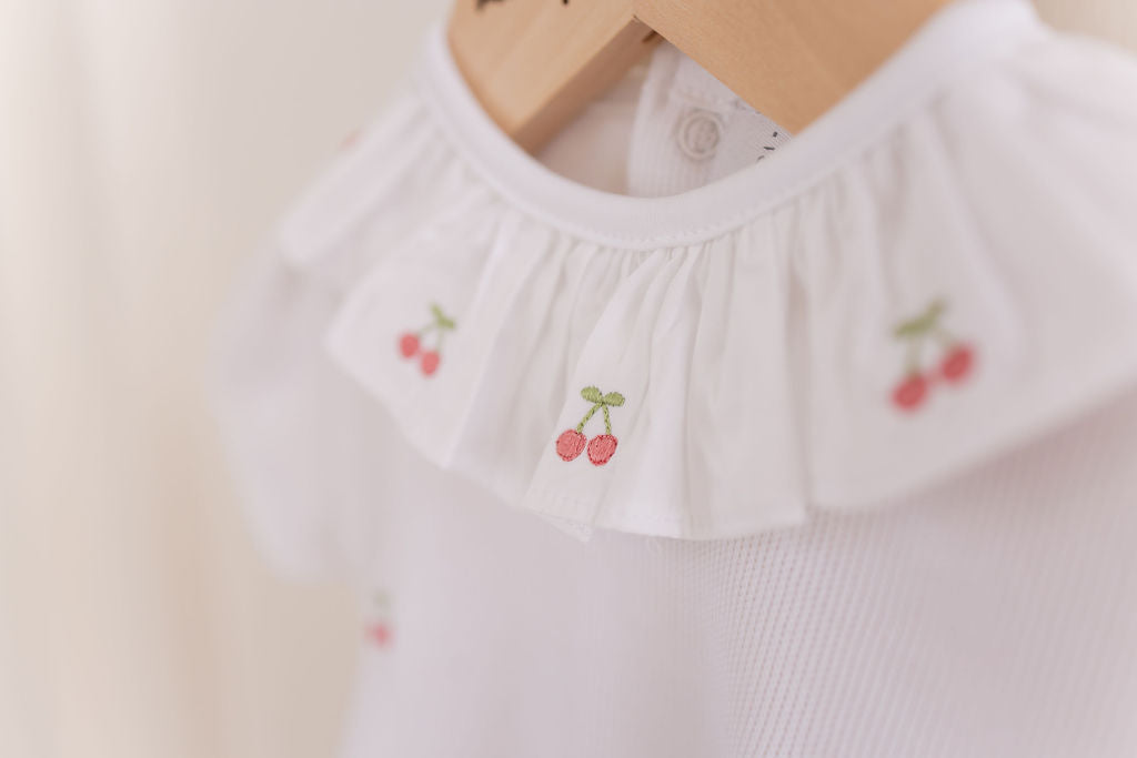 CERISE EMBROIDERED ROMPER