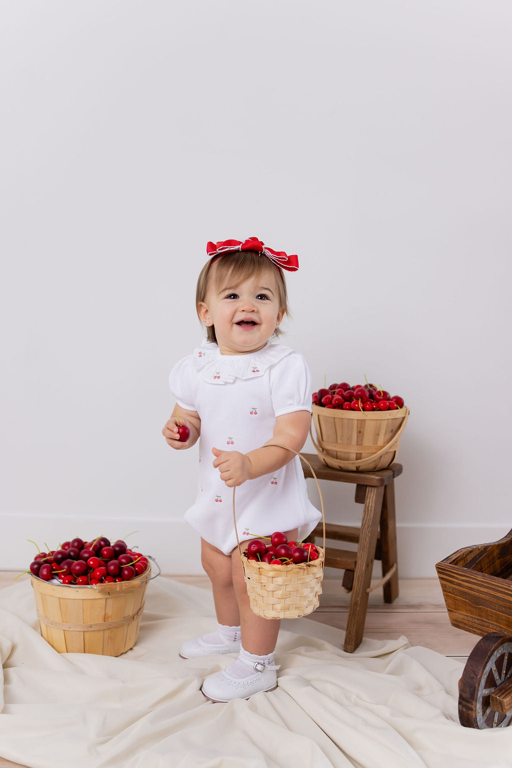 CERISE EMBROIDERED ROMPER