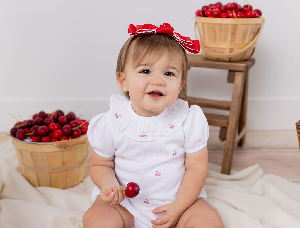 CERISE EMBROIDERED ROMPER