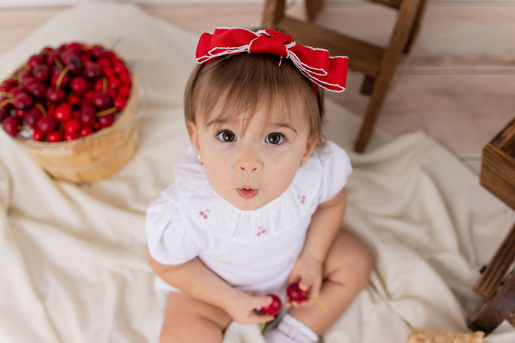 CERISE EMBROIDERED ROMPER
